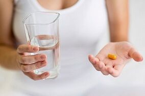 Taking medicine to treat foot fungus